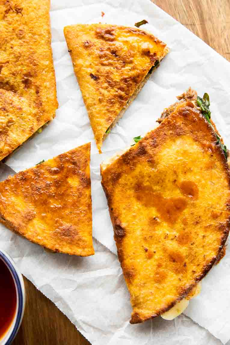 Birria Quesadillas dipped in broth.