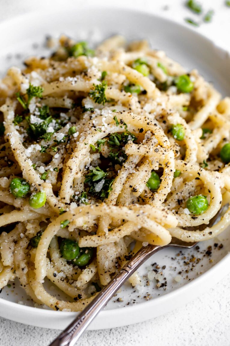 Angled close up of Bucatini Cacio E Pepe.