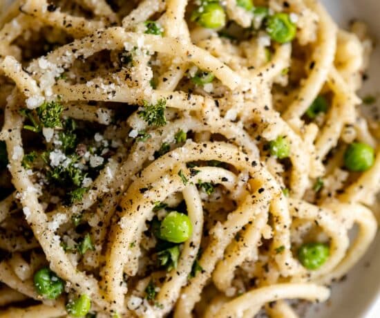 Top shot photo of Bucatini Cacio E Pepe on a plate.
