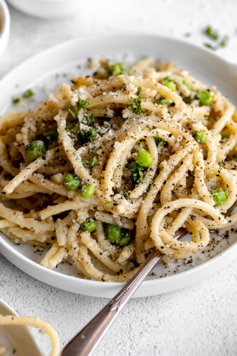 Angled photo of Bucatini Cacio E Pepe.