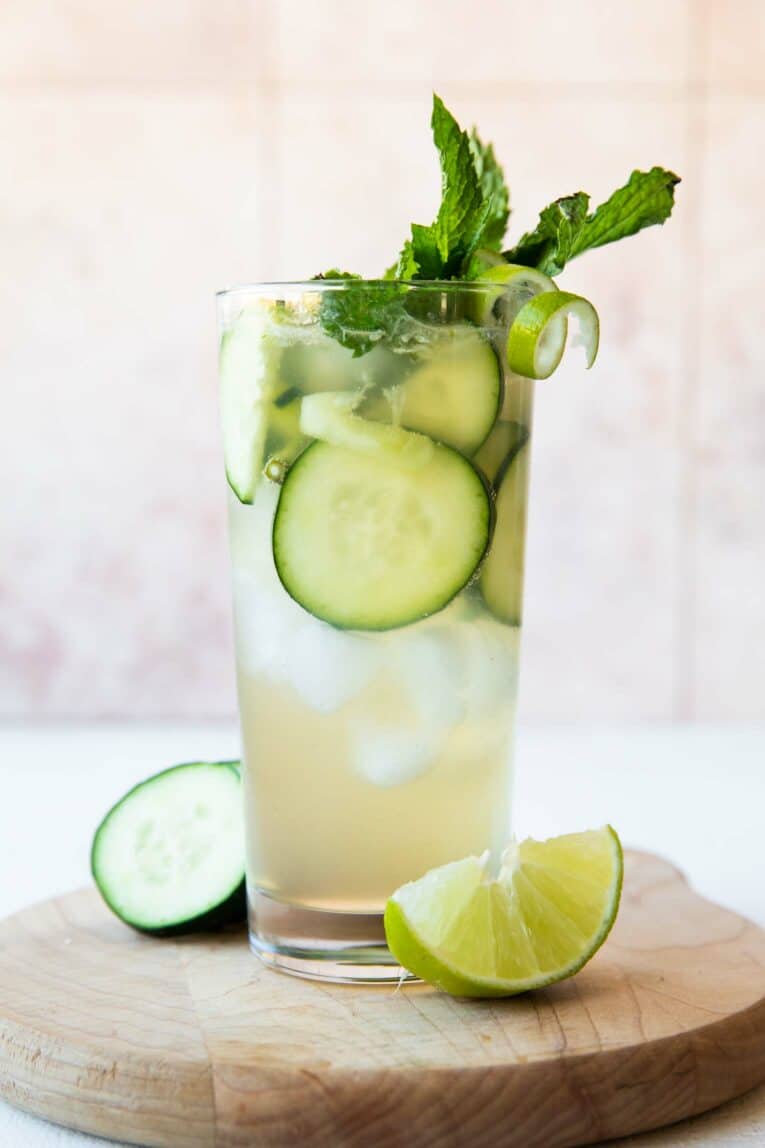 Cucumber Lime Spritzer (Non-Alcoholic) garnished with cucumbers, lime twist, and mint.