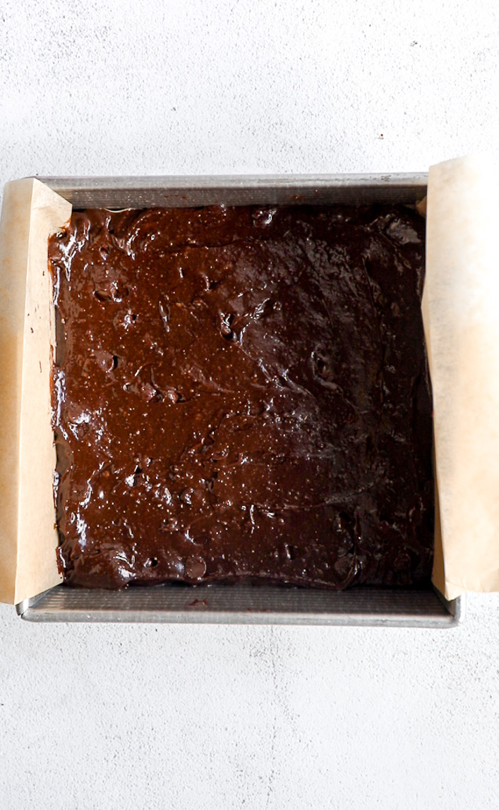 Tahini brownie batter in a baking pan.