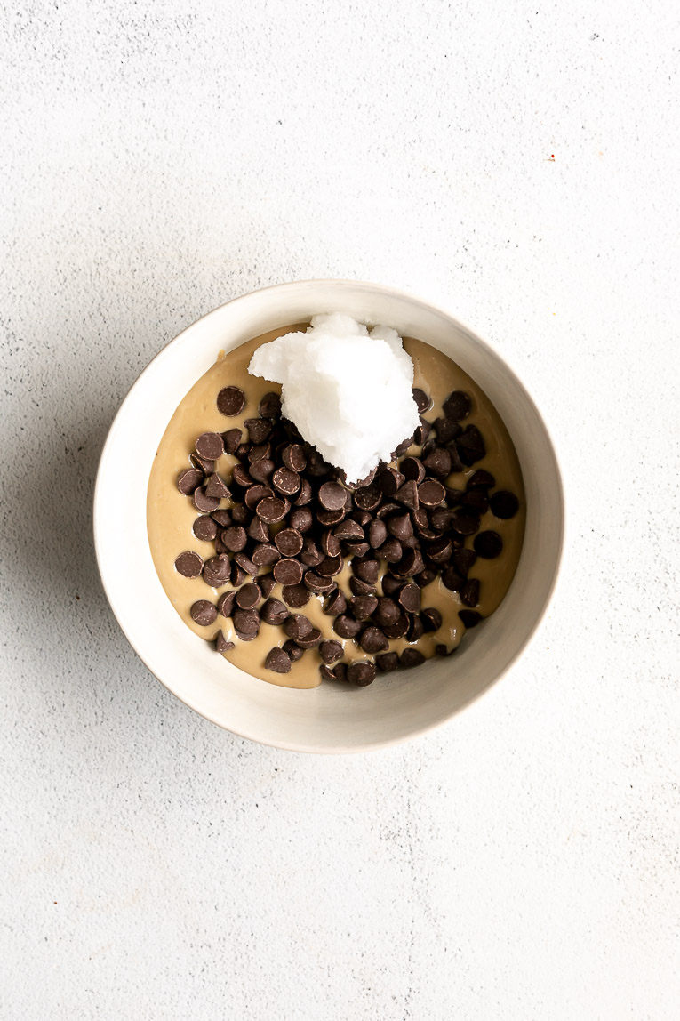 Tahini, chocolate chips, and coconut oil being melted together.
