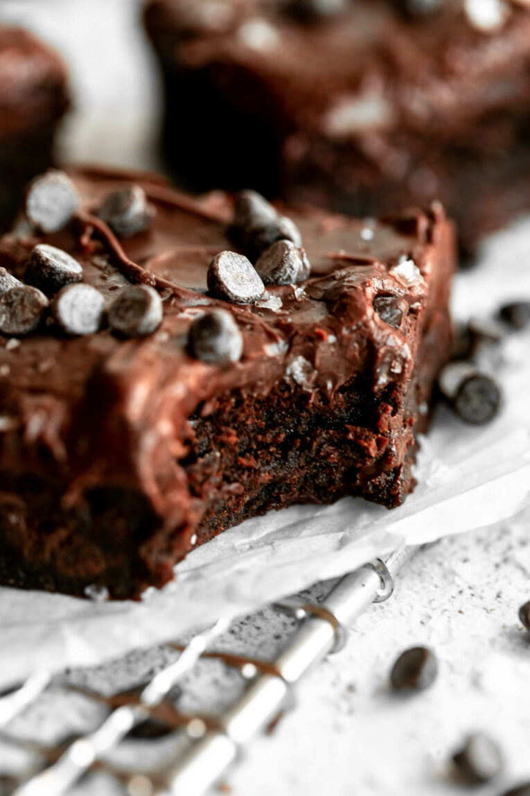 Close up angled photo of fudge tahini brownie.