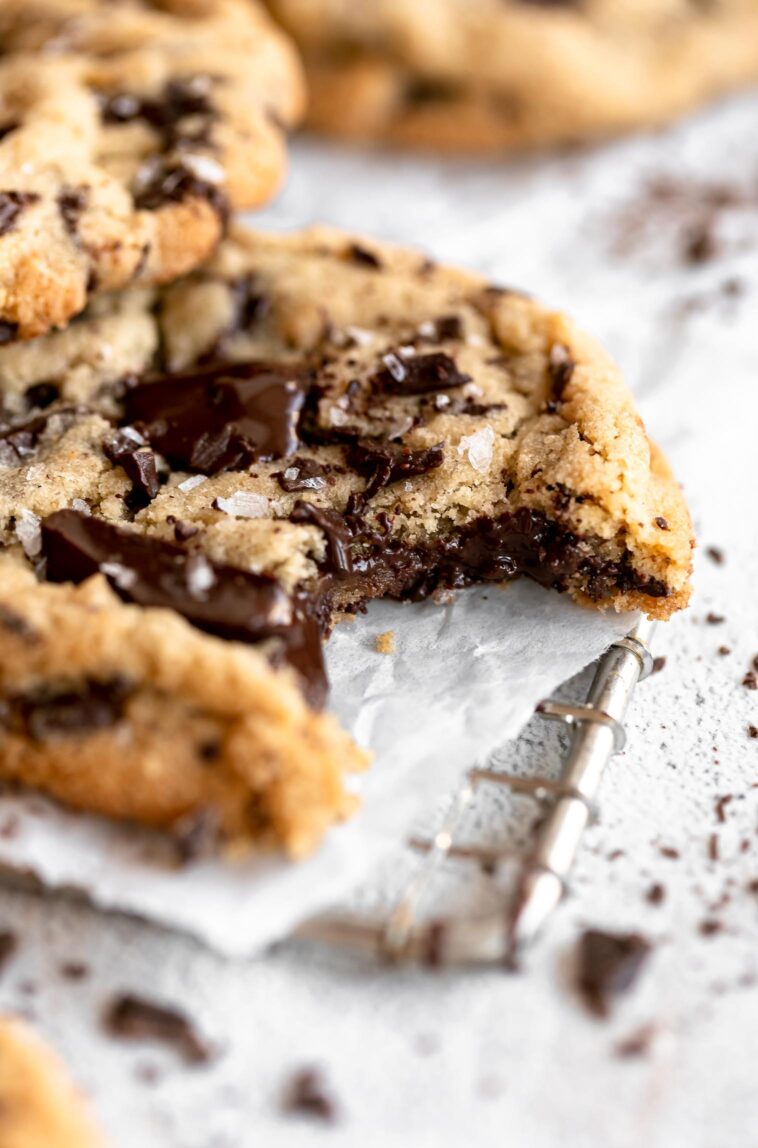 Tahini Chocolate Chip Cookies angled close up with bite taken out.