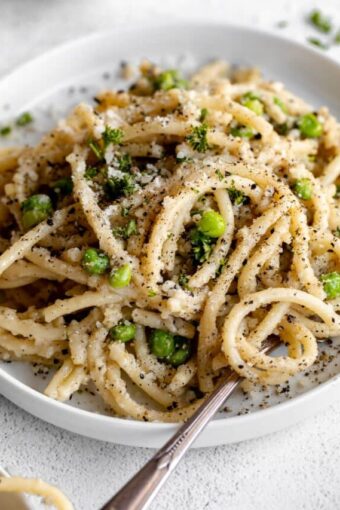 Angled photo of Bucatini Cacio E Pepe.