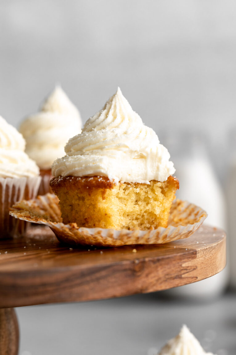 Almond flour cupcakes with bite taken out in wrapper.
