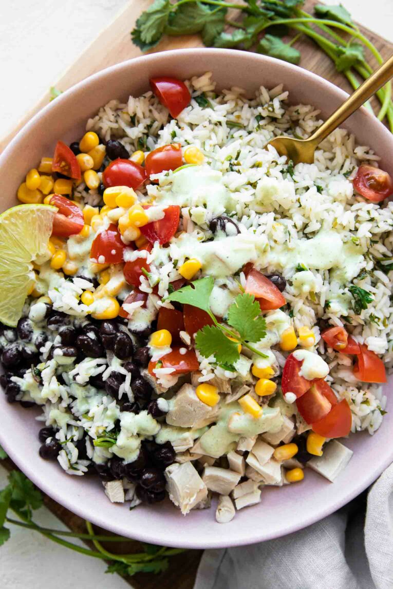Cilantro Lime Rice Bowl with corn, beans, tomatoes, and chicken.