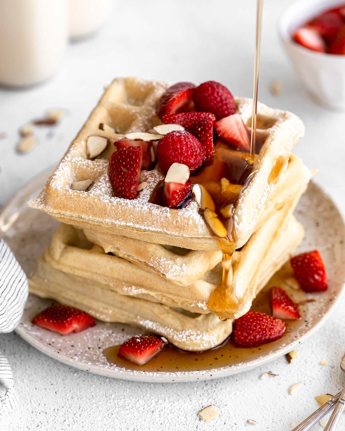 Gluten-Free Waffles Recipe stacked on a plate.