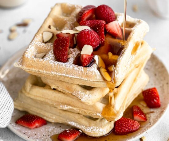 Gluten-Free Waffles Recipe stacked on a plate.