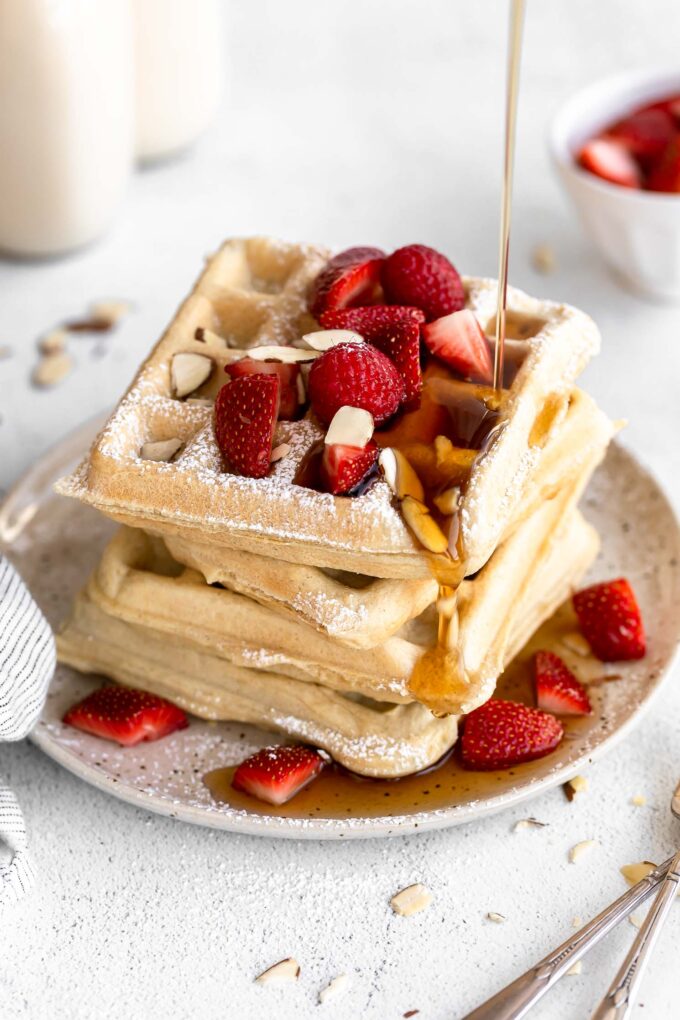 Gluten-Free Waffles Recipe stacked on a plate.