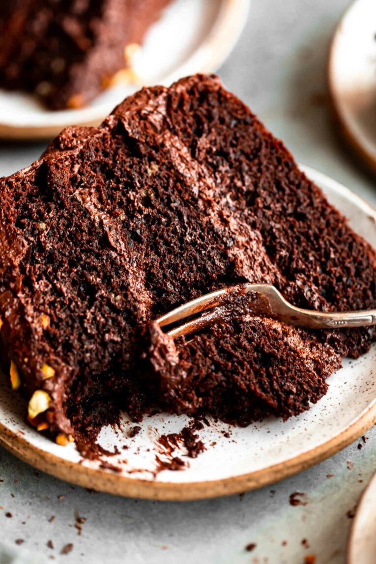 Slice of Healthy Chocolate Cake w/ Tahini-Chocolate Icing.