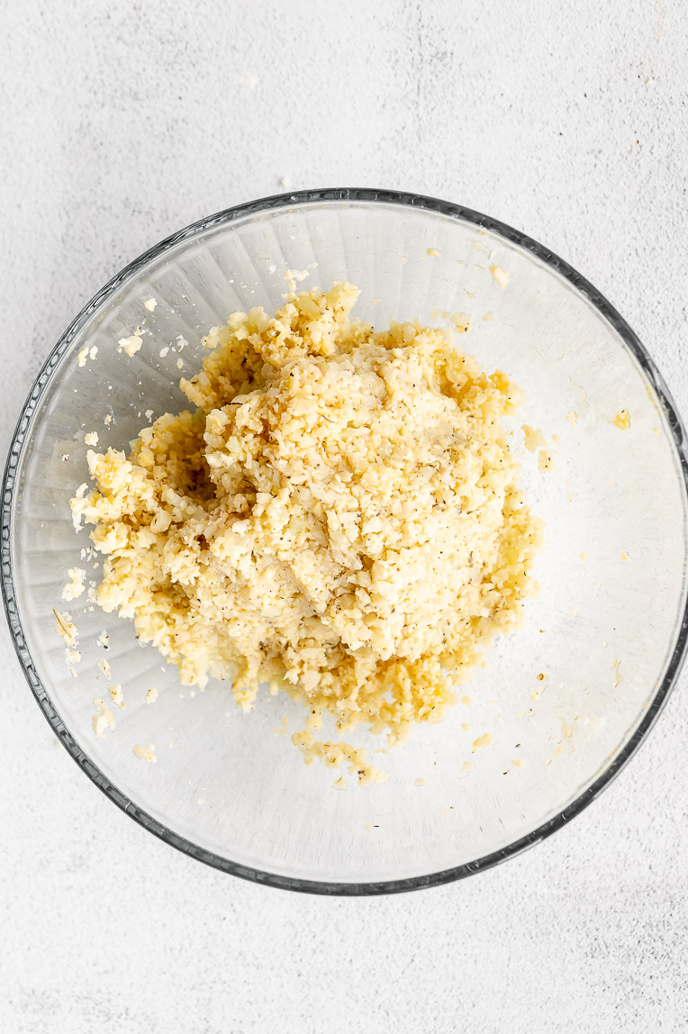cauliflower pizza crust dough in a mixing bowl.