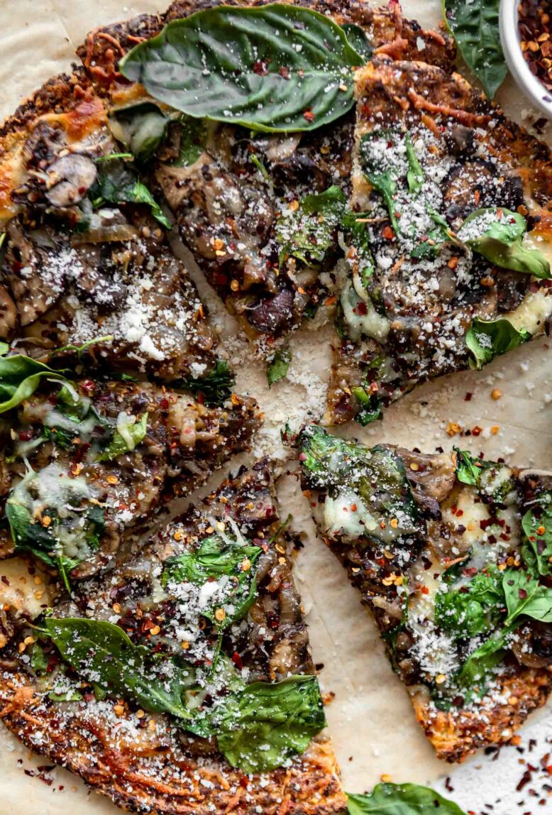 Top shot photo of mushroom cauliflower pizza.