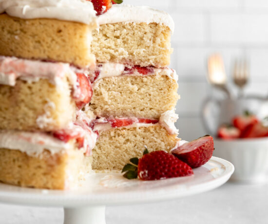 3-layer Vegan Strawberry Shortcake recipe on a cake stand.
