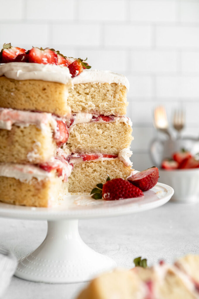 3-layer Vegan Strawberry Shortcake recipe on a cake stand.