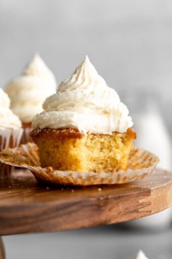 Almond flour cupcakes with bite taken out in wrapper.