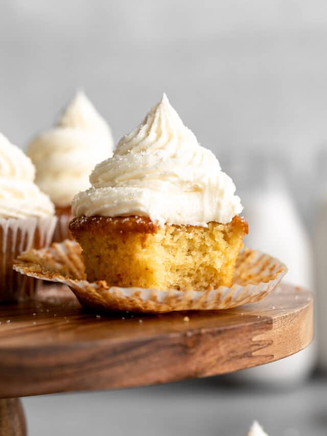 Almond flour cupcakes with bite taken out in wrapper.