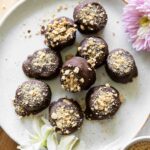 Healthy S'mores Banana Bites recipe on a plate with graham cracker crumbs.