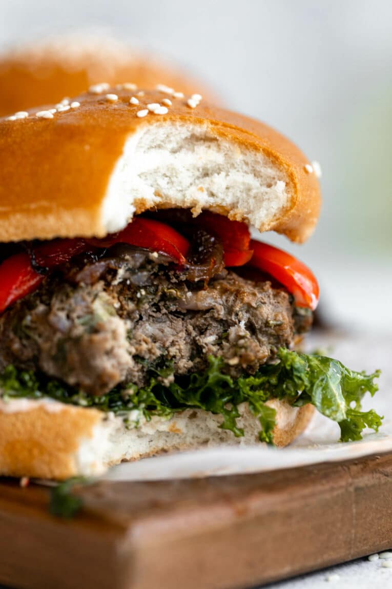 Healthy beef burger with kale and peppers.