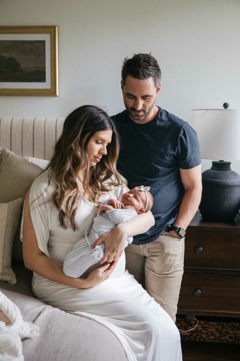 Baby girl with mom and dad.