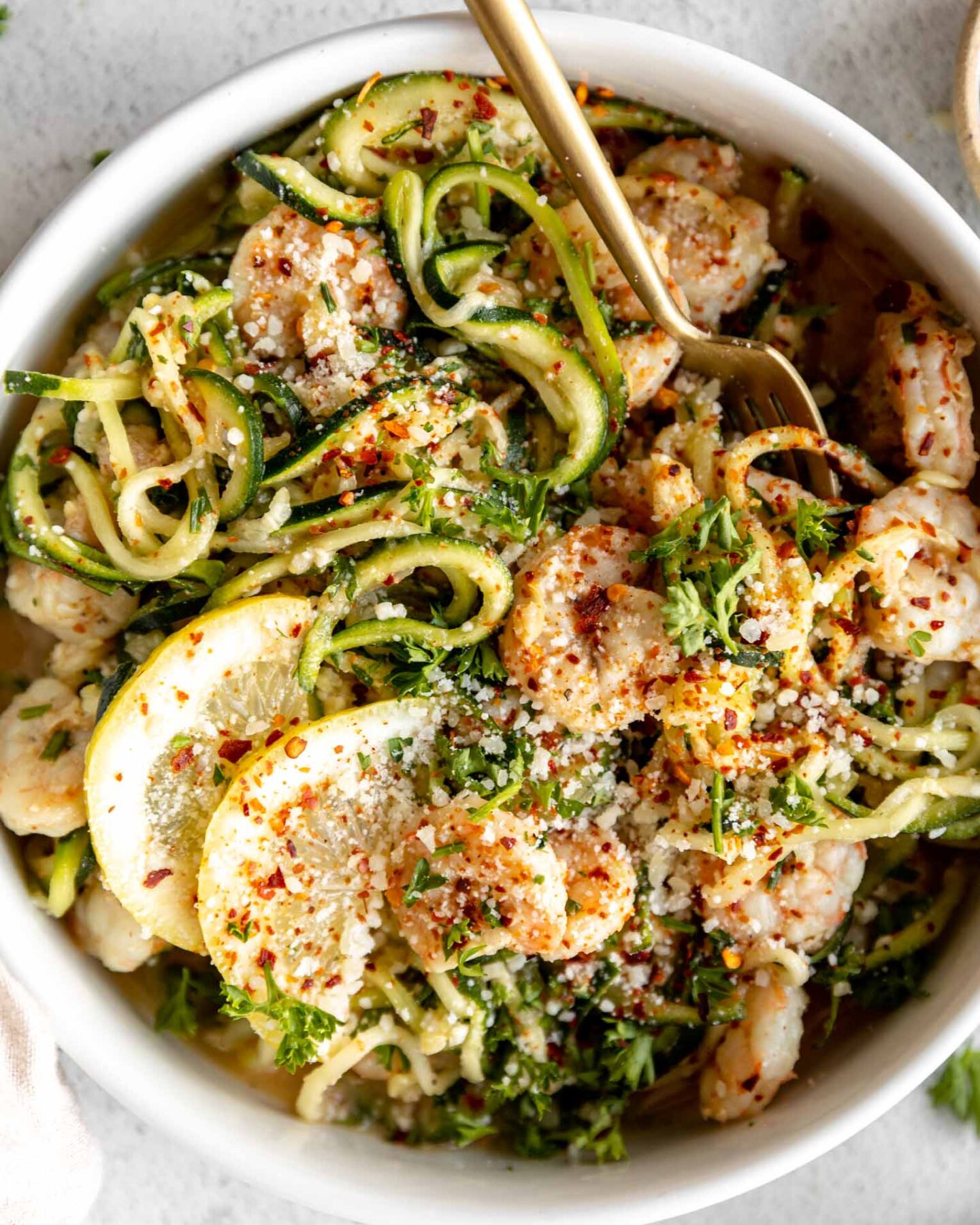 Shrimp Scampi w/ Zucchini Noodles recipe in a bowl with a fork.