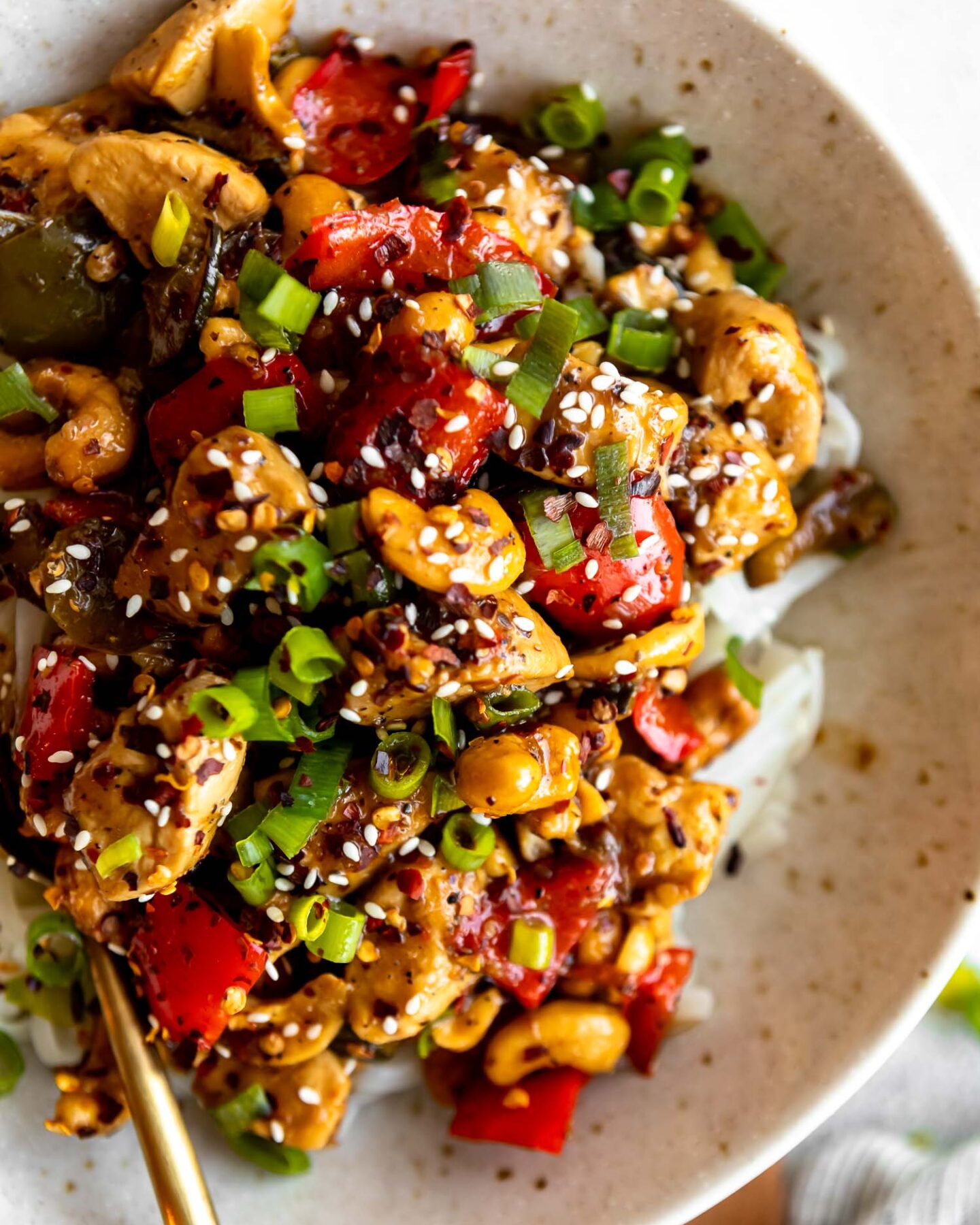 Spicy Cashew Chicken Noodle Bowl with fork.