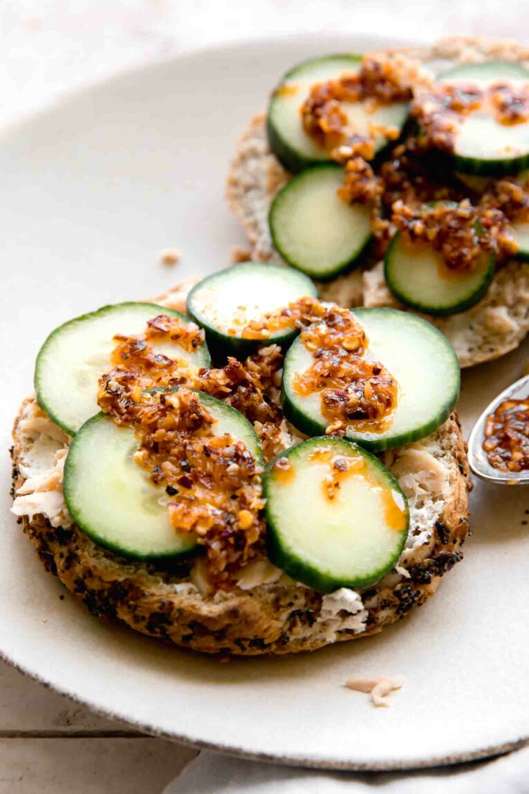 Angled photo of Chili Crunch Salmon Cream Cheese Bagels.