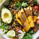 Chili Mango Zesty Quinoa Salad with fork and lime.