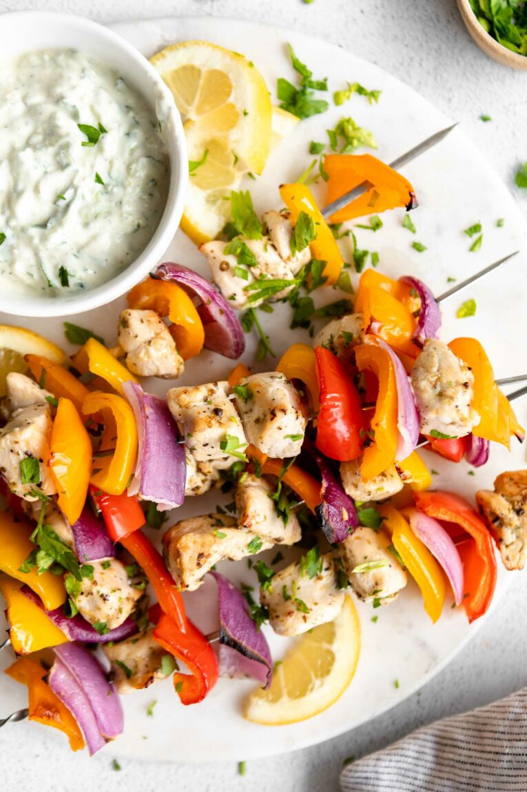 Close up of Greek Chicken Kabobs with Tzatziki sauce.