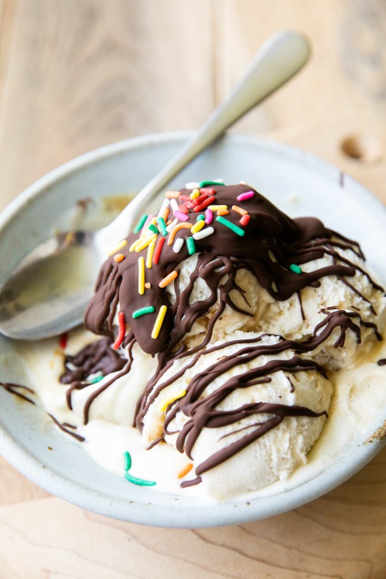 Magic shell recipe on ice cream in a bowl.