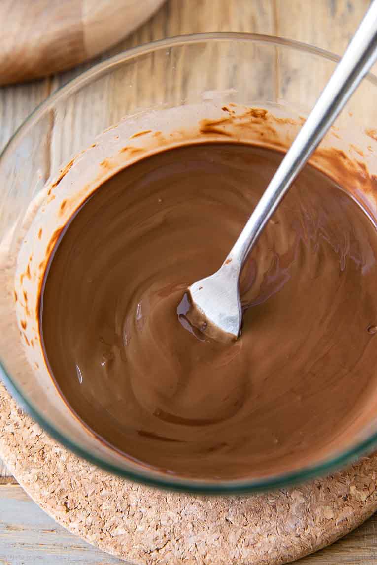 Melted chocolate in a mixing bowl.