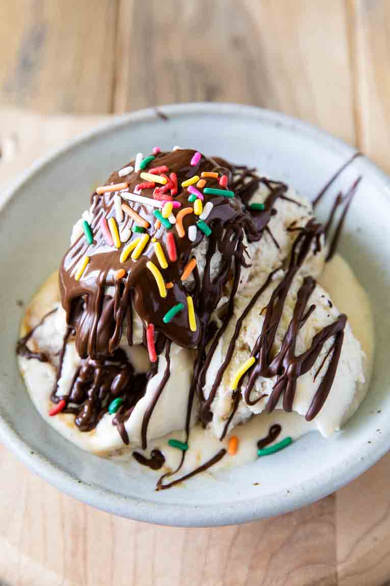 Chocolate melted magic shell drizzled over ice cream.