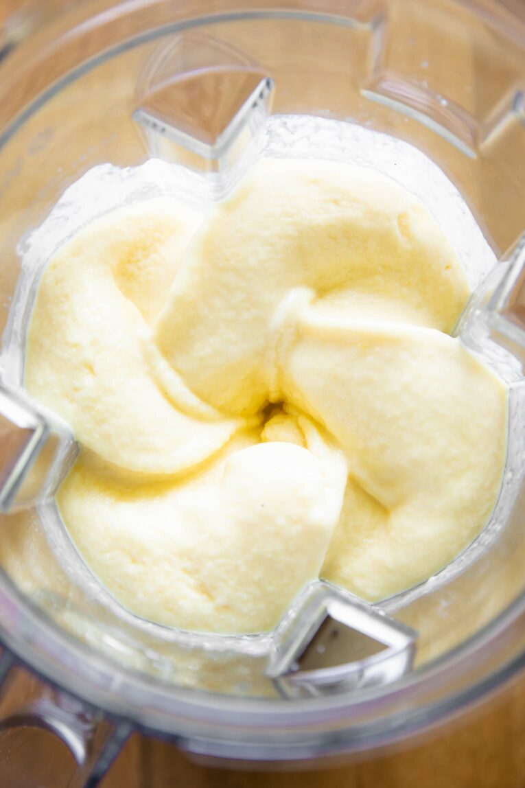Mango smoothie being blended.