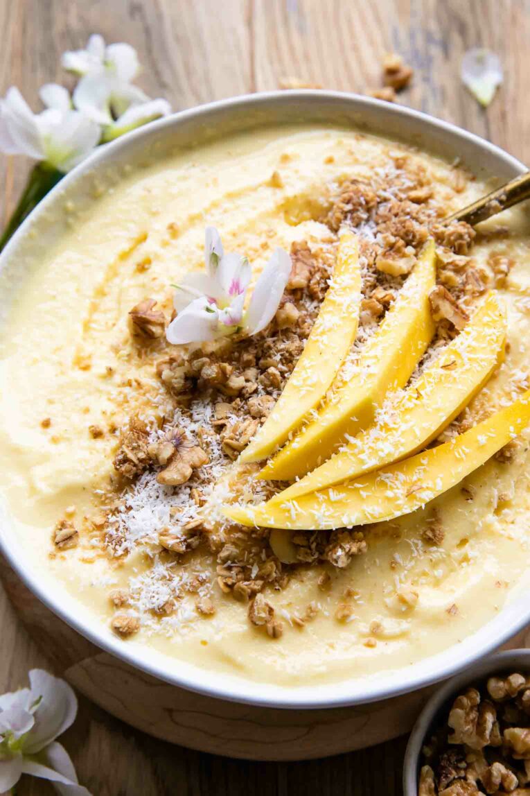 Angled photo of Mango Pineapple Smoothie bowl.