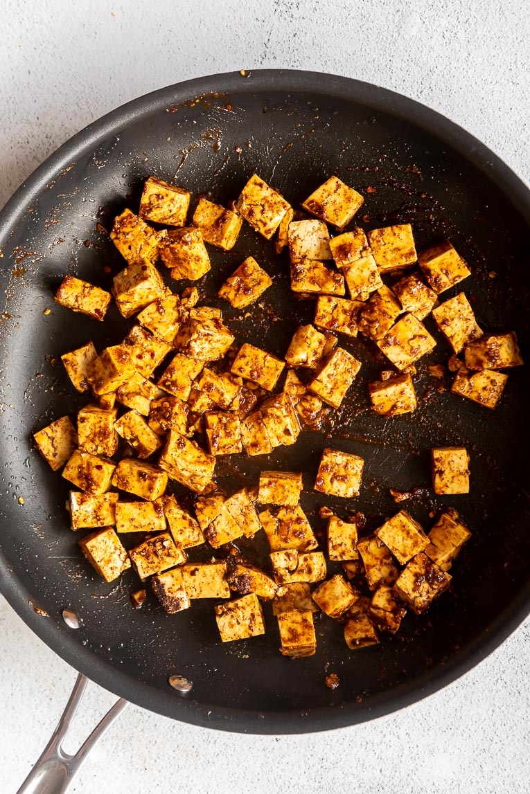Tofu taco meat in a skillet being cooked.