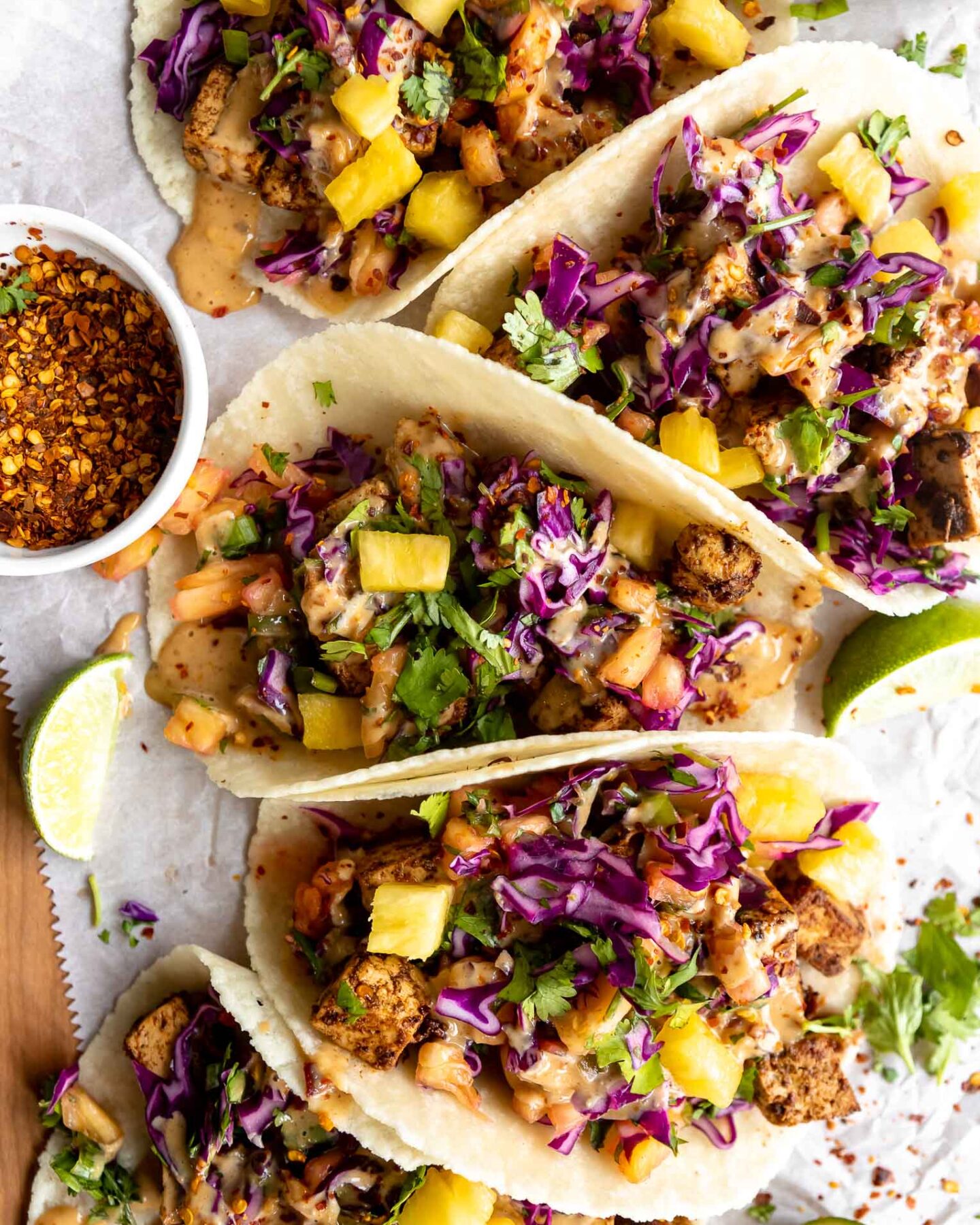 Vegan Spicy Thai Tofu Tacos on a wood table.