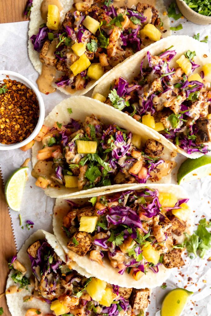 Vegan Spicy Thai Tofu Tacos on a wood table.