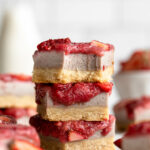 Stack of healthy Strawberry Cheesecake Bars.