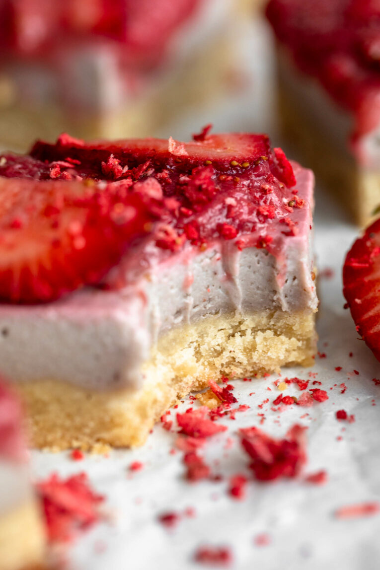 Close up of Strawberry Cheesecake Bar with bite taken out.