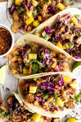 Vegan Spicy Thai Tofu Tacos on a wood table.