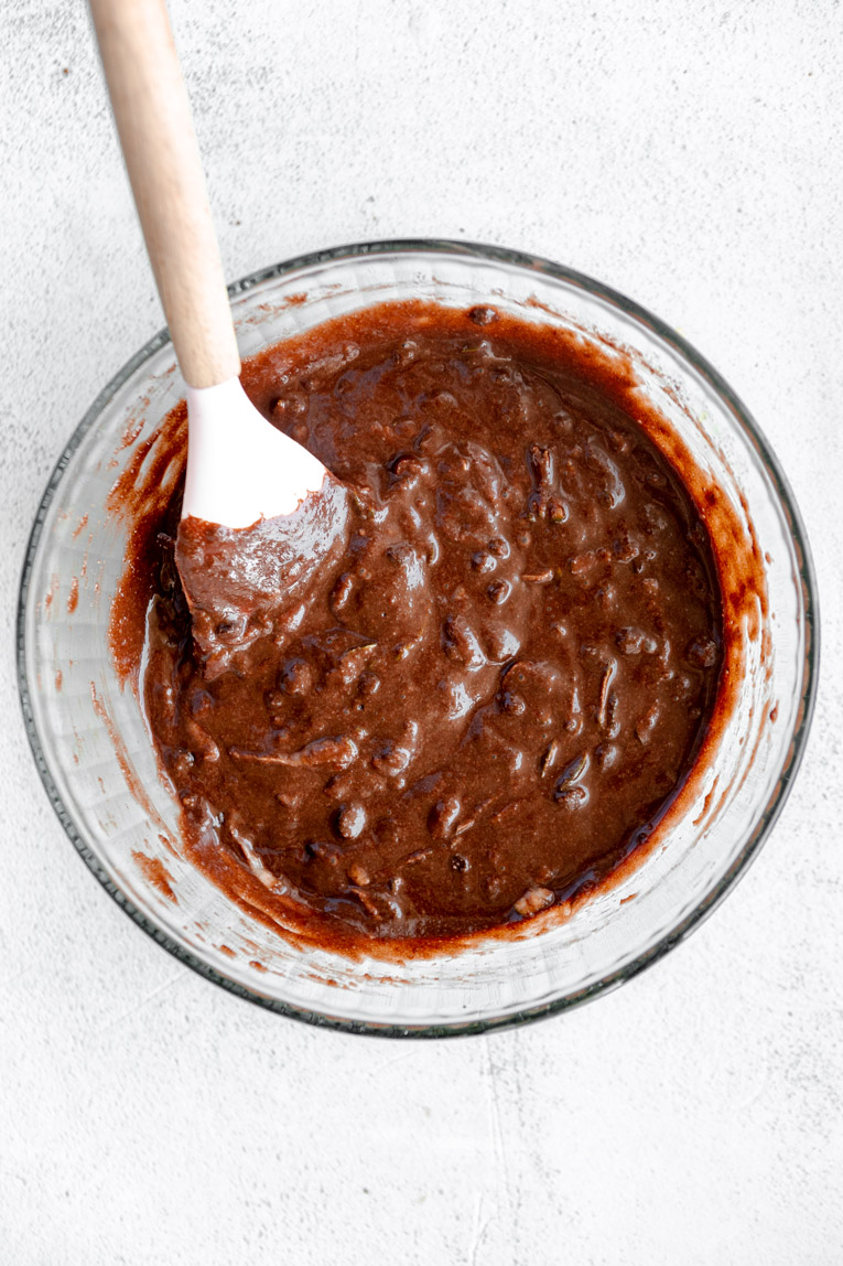 Chocolate zucchini muffins batter in a bowl.
