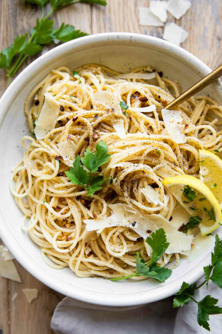 Lemon Garlic Pasta in a white bowl with a fork.