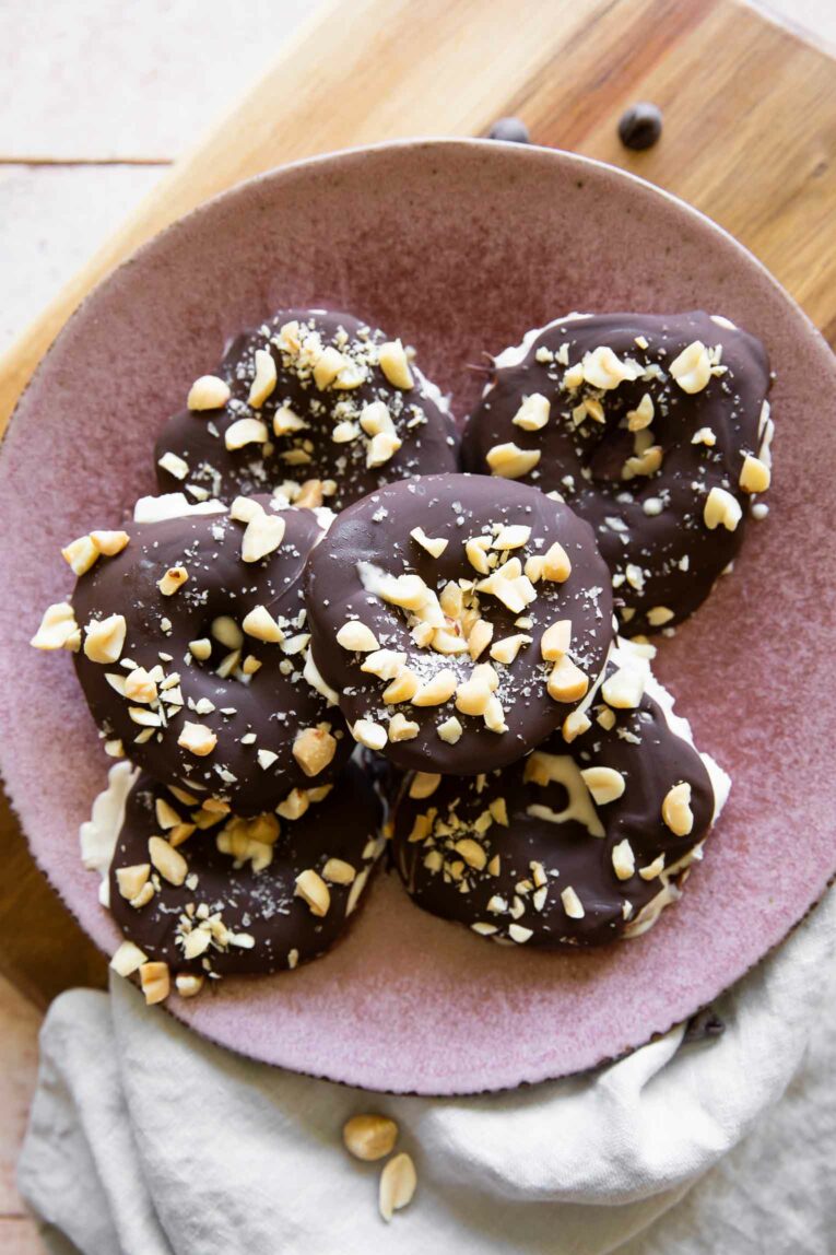 Top shot photo of Chocolate Covered Apples on a pink plate.
