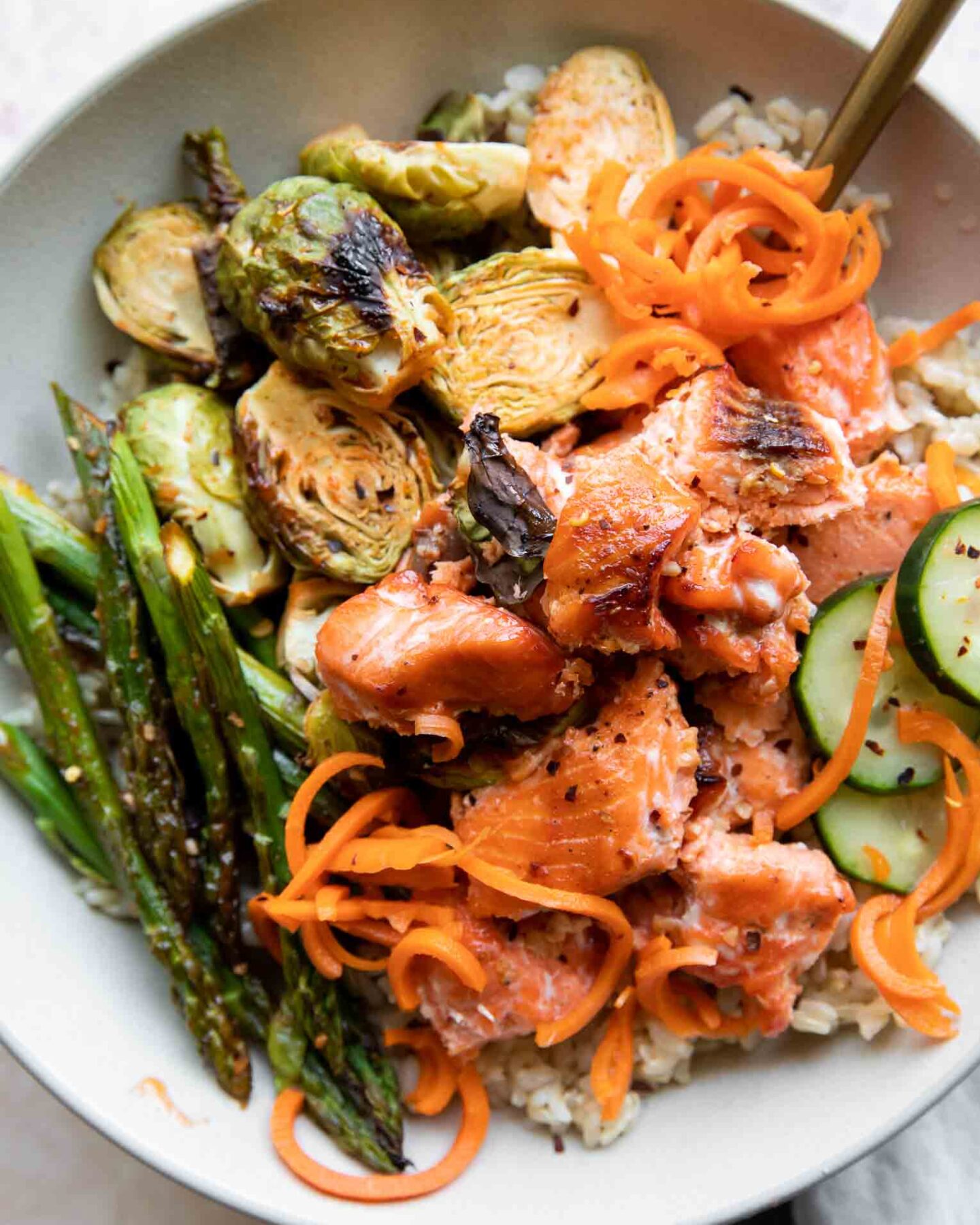Hot Honey Salmon Bowl recipe with a fork.