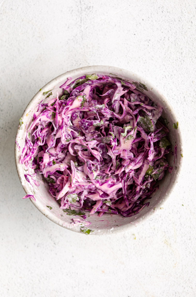 Red cabbage slaw healthy for fish taco bowls.