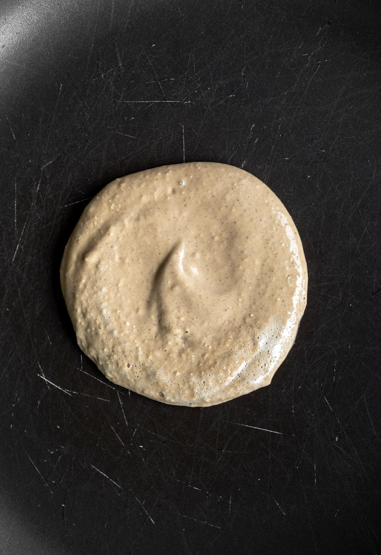 Peanut butter protein pancakes being cooked.