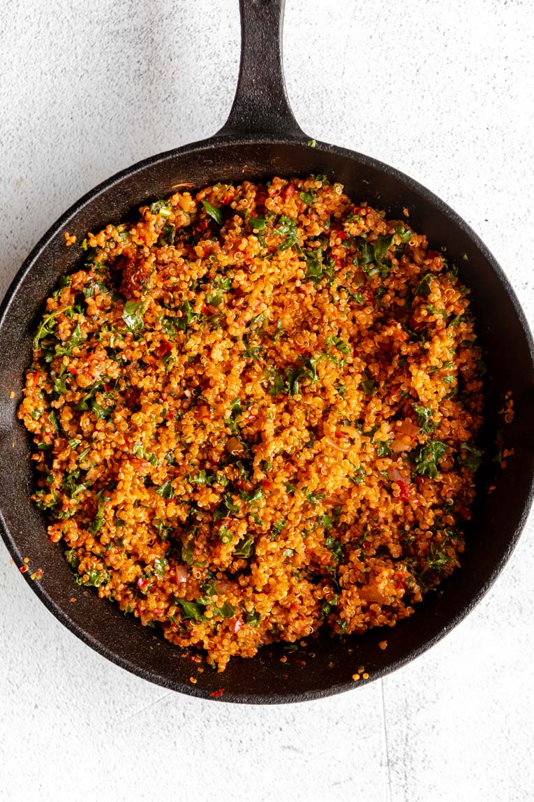 Stuffed eggplant quinoa harissa filling in a skillet.
