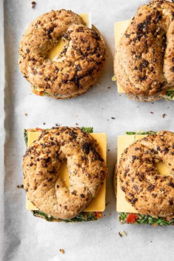 Meal Prep Breakfast Egg Bagels on parchment paper.