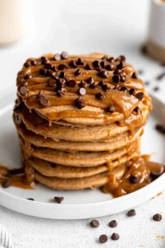 Angled photo of Mocha Protein Peanut Butter Pancakes on a plate.